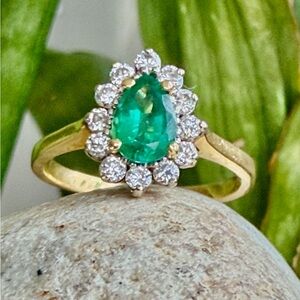 18 karat gold emerald, and diamond Ring